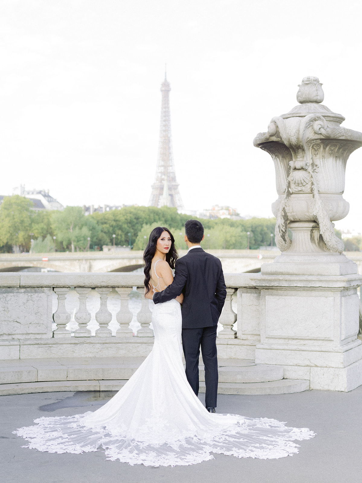 Bride looking at photographer on Alexander III Bridge 